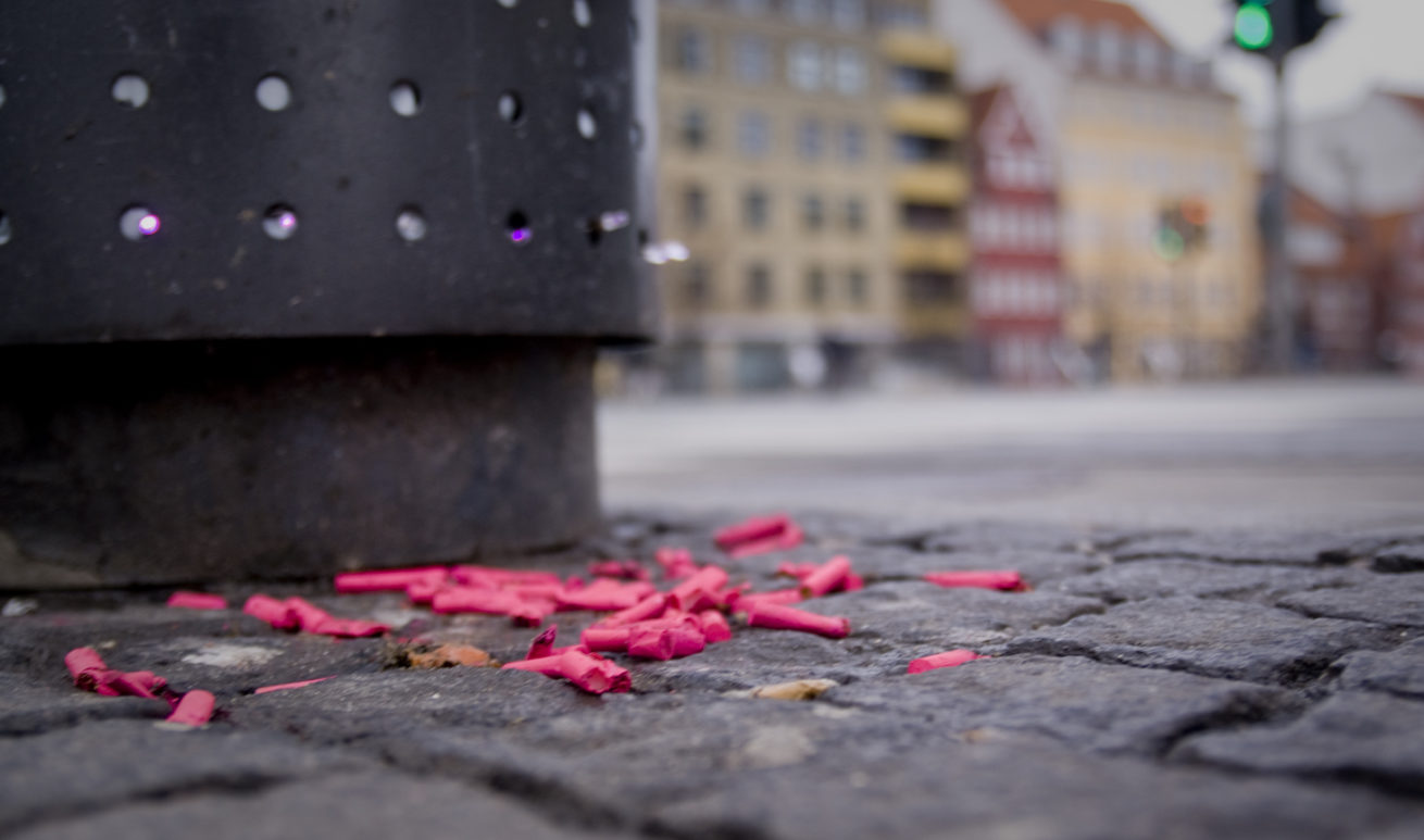Trash attack Copenhagen pink trash on ground cigerate