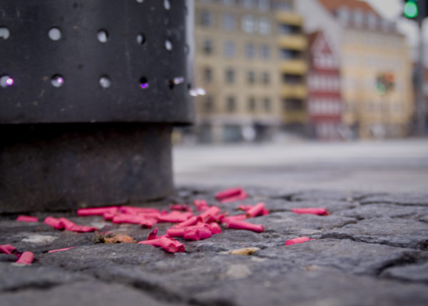 Trash attack Copenhagen pink trash on ground cigerate